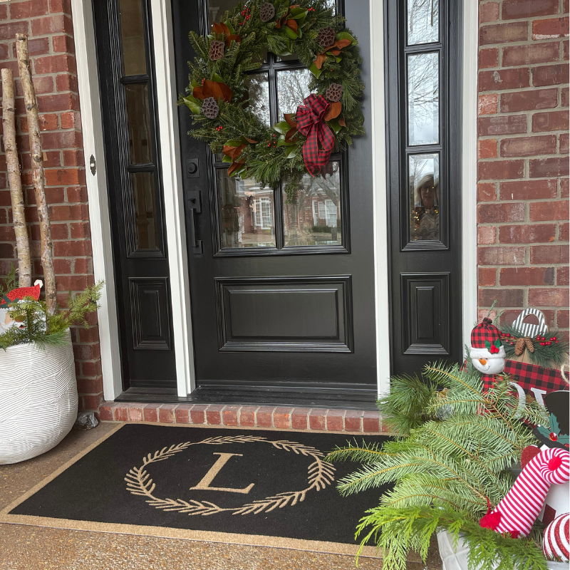 Black doormat with letter L.