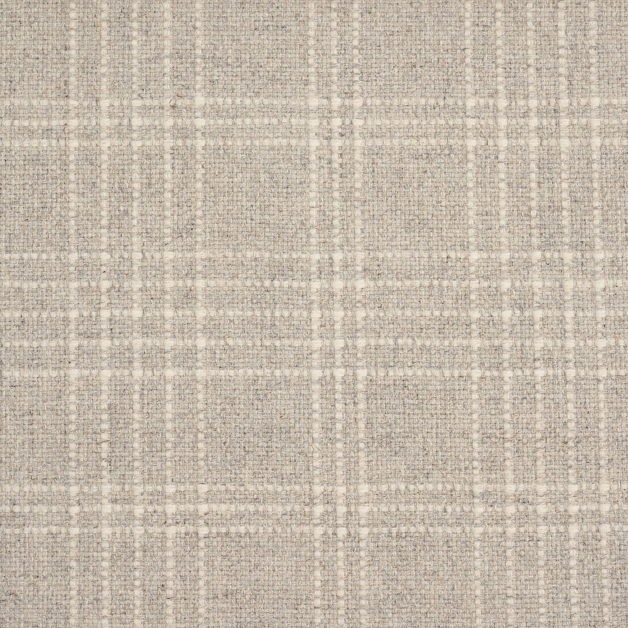 A close-up of a woven fabric texture in a warm beige and off-white plaid pattern.