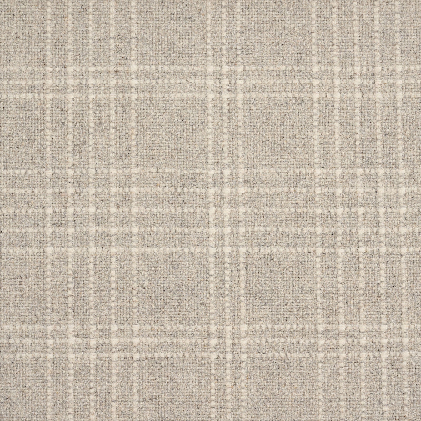 A close-up of a woven fabric texture in a warm beige and off-white plaid pattern.