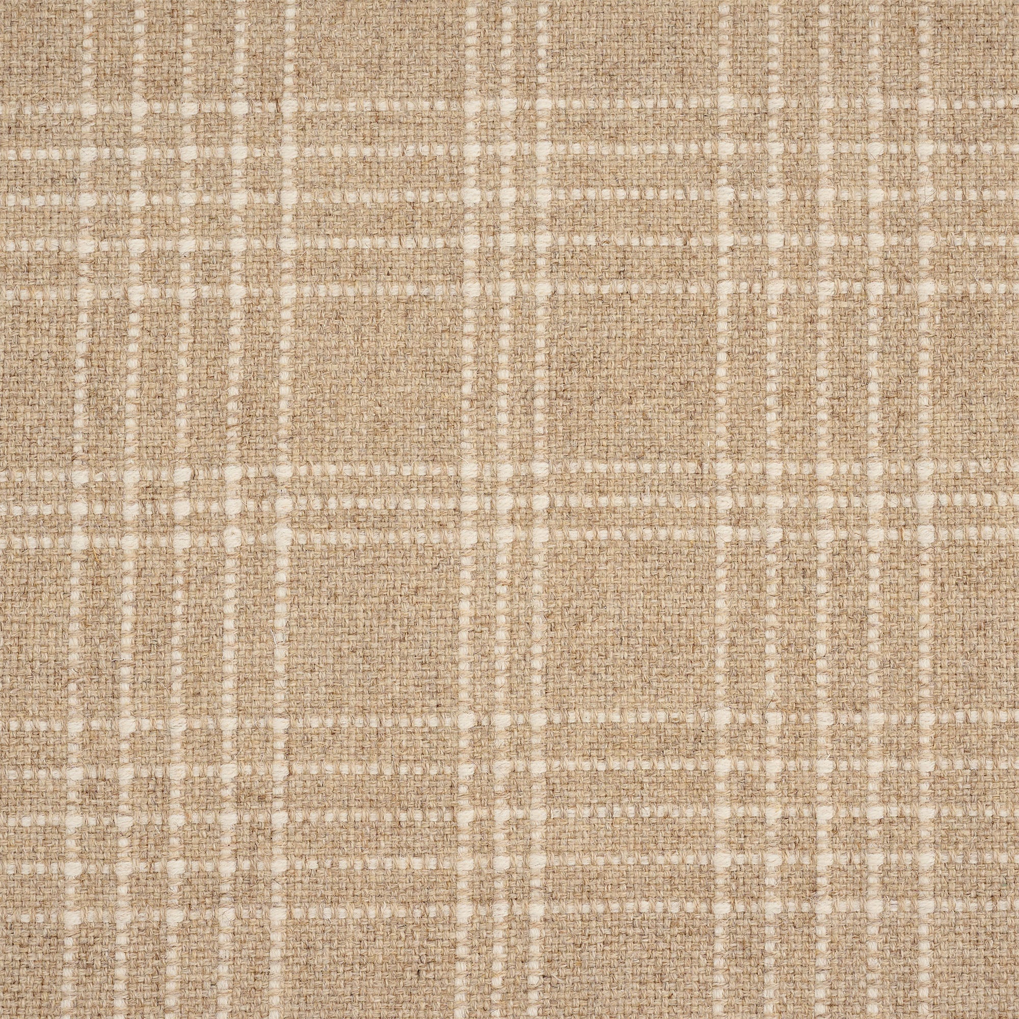 A close-up of a woven fabric with a beige and tan textured base, overlaid with a subtle white plaid pattern.