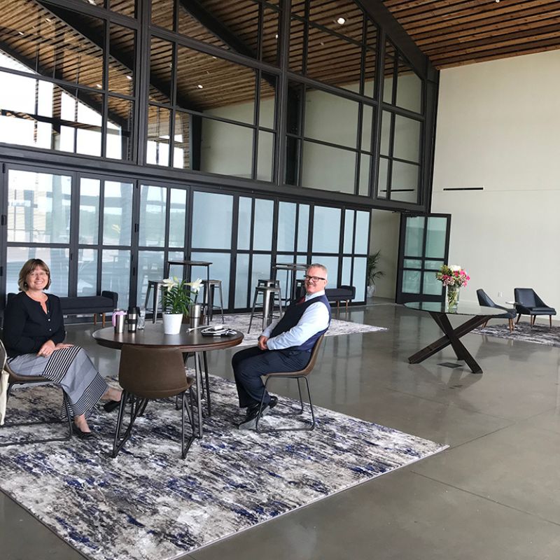Commercial blue and white custom rug in office reception area - modern, durable and easy to clean.