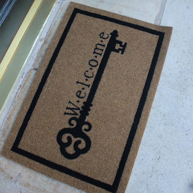 Custom all-weather Infinity doormat in black and tan, fade and shed resistant, perfect for front doors, patios, and high-traffic outdoor areas by RugsThatFit