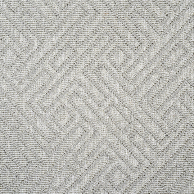Light grey rug with light grey geometric pattern