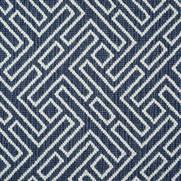 Navy blue rug with white geometric pattern